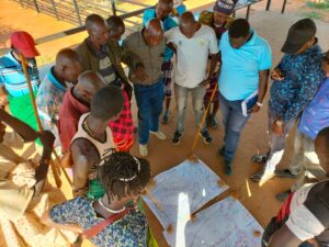 This photo shows participatory resource mapping and land use planning in Lpus community land Samburu County. This involved bringing together all the community social groups to strategically plan their land accordingly.