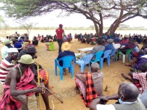 This photo shows a community wide meeting where community assembly meeting was organized to review and adopt the community bylaws and the register of members. This is Sesia Community Land in Samburu County which was able to submit their registration documents and was subsequently registered and received their community land title.