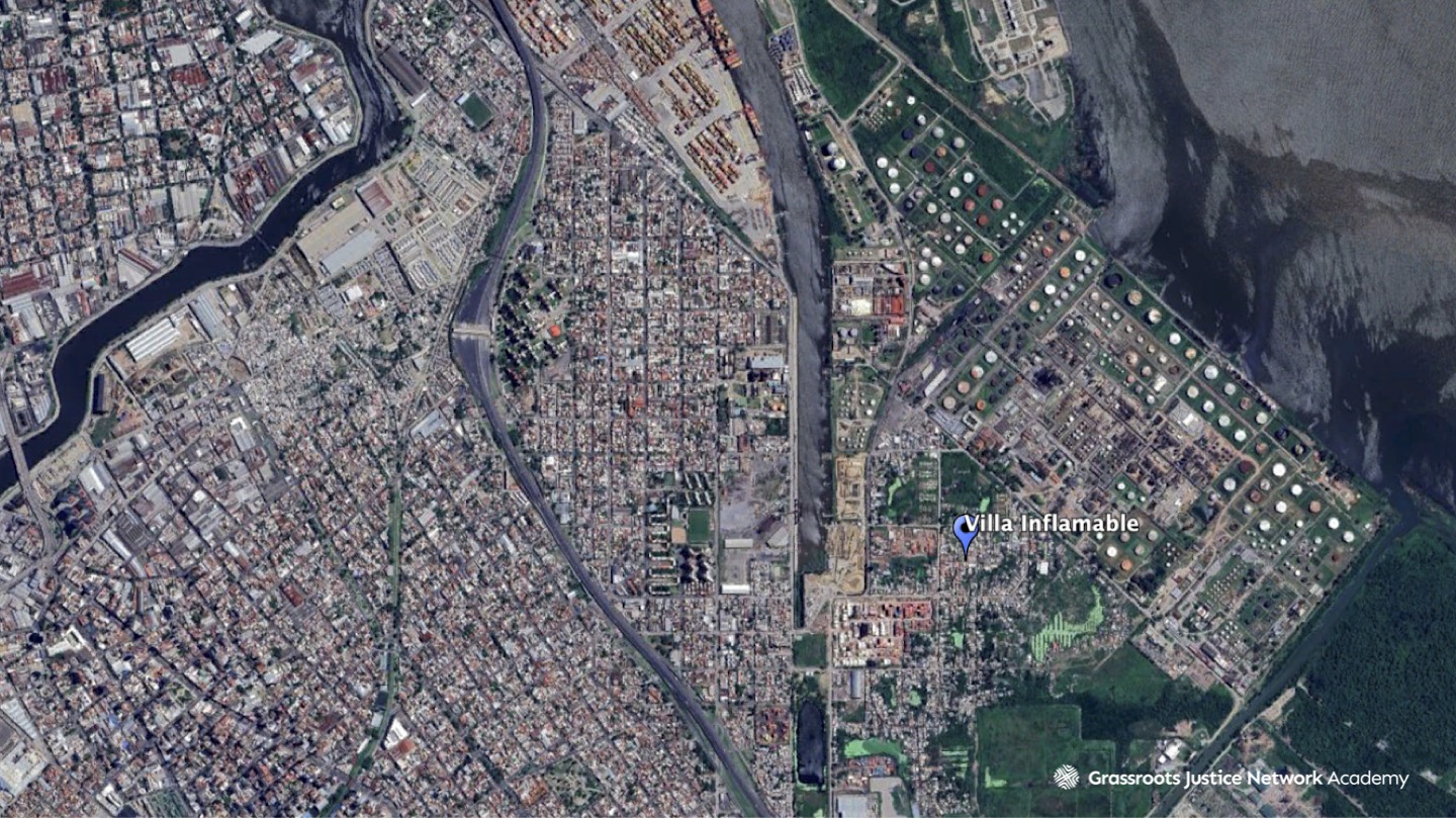 A zoomed-in satellite image of Villa Inflamable located near the Matanza-Riachuelo River Basin in Argentina. Factory buildings that have contributed to the pollution are more visible along the River Basin. 