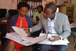 Nondo speaking about client intake and case management with Nadcao staff member Sinazo and paralegals of the Messina advice office on the Zimbabwe border
