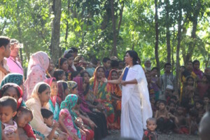Observing a domestic violence community training that BNWLA is facilitating in an ethnic minority fishing village outside Cox's Bazaar.