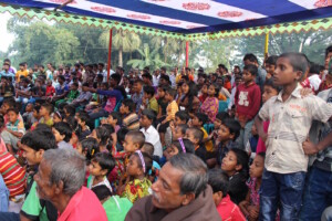 Community members watching a Theater for Development show on gender equality in Rajshahi.