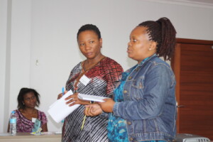 Barbara Bisikwa & Claudine Tsongo presenting on each other's work during the orientation.