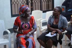 Eleane Keanue speaking with the Director of WLAC at their offices.
