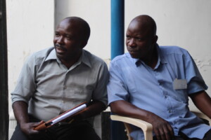 Local Tanzanian paralegals Hamza Mohamed And Wolfram Nziku listening to group discussion at WLAC’s office.