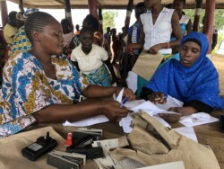 Registrars during a mobile birth registration organized by Community Paralegals in Malindi