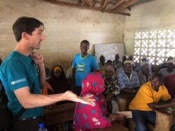 Michael Otto (Namati) during a community education forum with Haki Center Paralegals and Learning exchange participants in Kwale