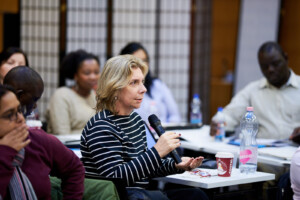 Denise Dora of THEMIS in Brazil speaks to the group during a Case Study.