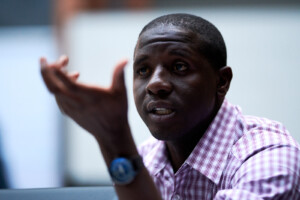 Paul Sixpence from Centre Stage Media Arts Foundation in Zimbabwe shares a comment during small group discussion.