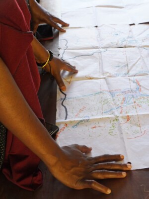 Participants looking over a map of community land.