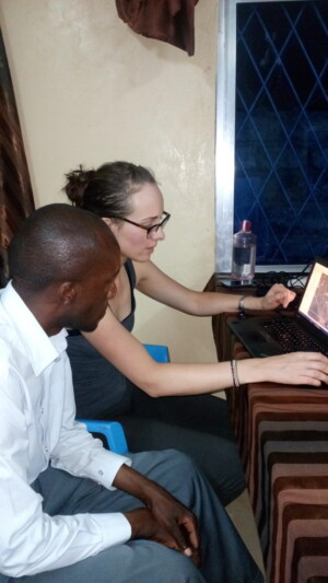Marena Brinkhurst and Tony Kyembwa discuss mapping software.