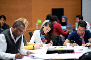 takes notes. Maria Victoria Gama of the Ministry of Justice Argentina takes notes.